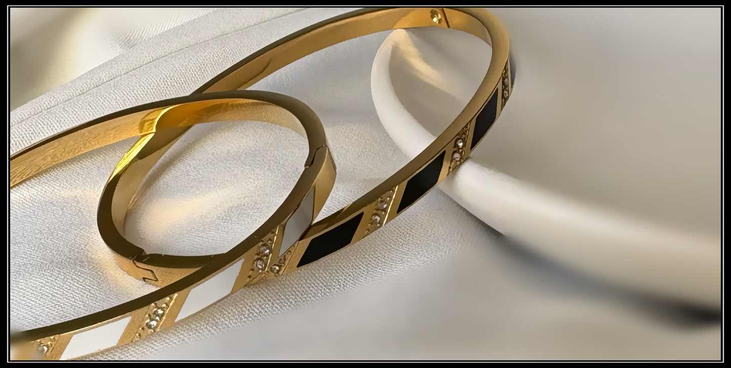 A. Stylish Gold and Black Enamel Bracelet with Diamond Details