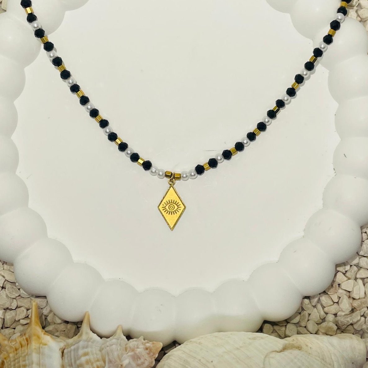 Elegant Enigma: Black Beaded Pendant Necklace